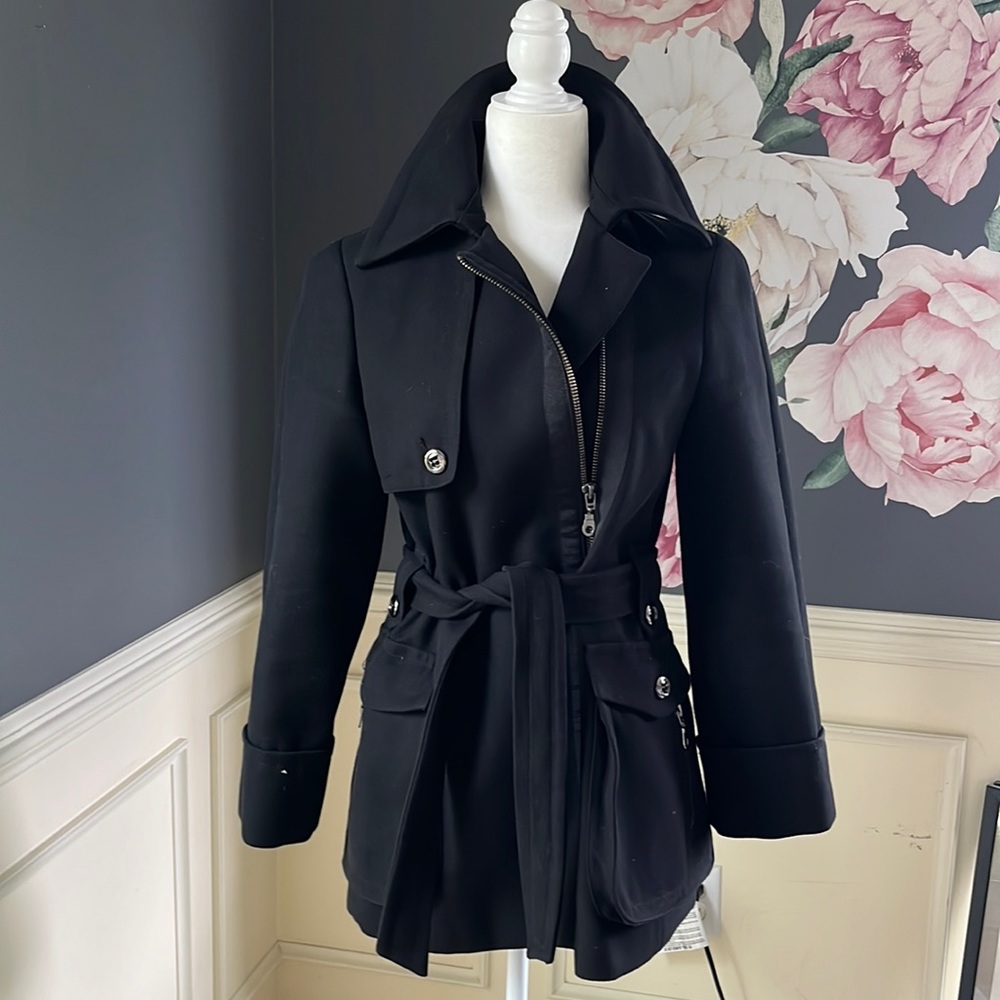 Black jacket with silver zipper and button detail